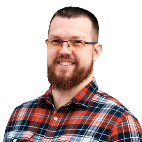 Ben Braker head and shoulders, wearing glasses, a beard, and plaid shirt