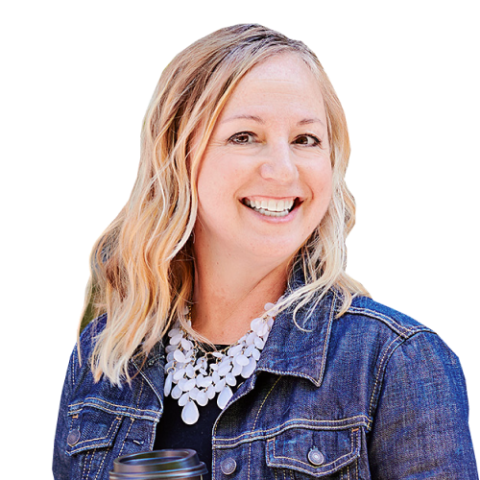 Lisa head and shoulders, with blonde hair, denim jacket, and chunky white necklace