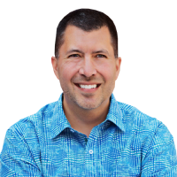 Brett Chaffer head and shoulders, wearing blue patterned dress shirt