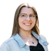 Haley head and shoulders, with glasses, brown hair, black shirt with light denim overshirt