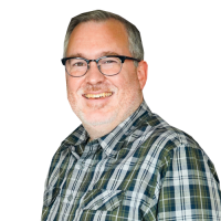 Jonathan Chaffer head and shoulders image, wearing glasses and a plaid shirt