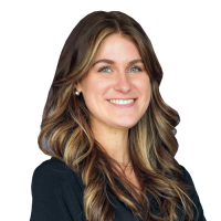 Megan head and shoulders, with long brown hair and a dark shirt